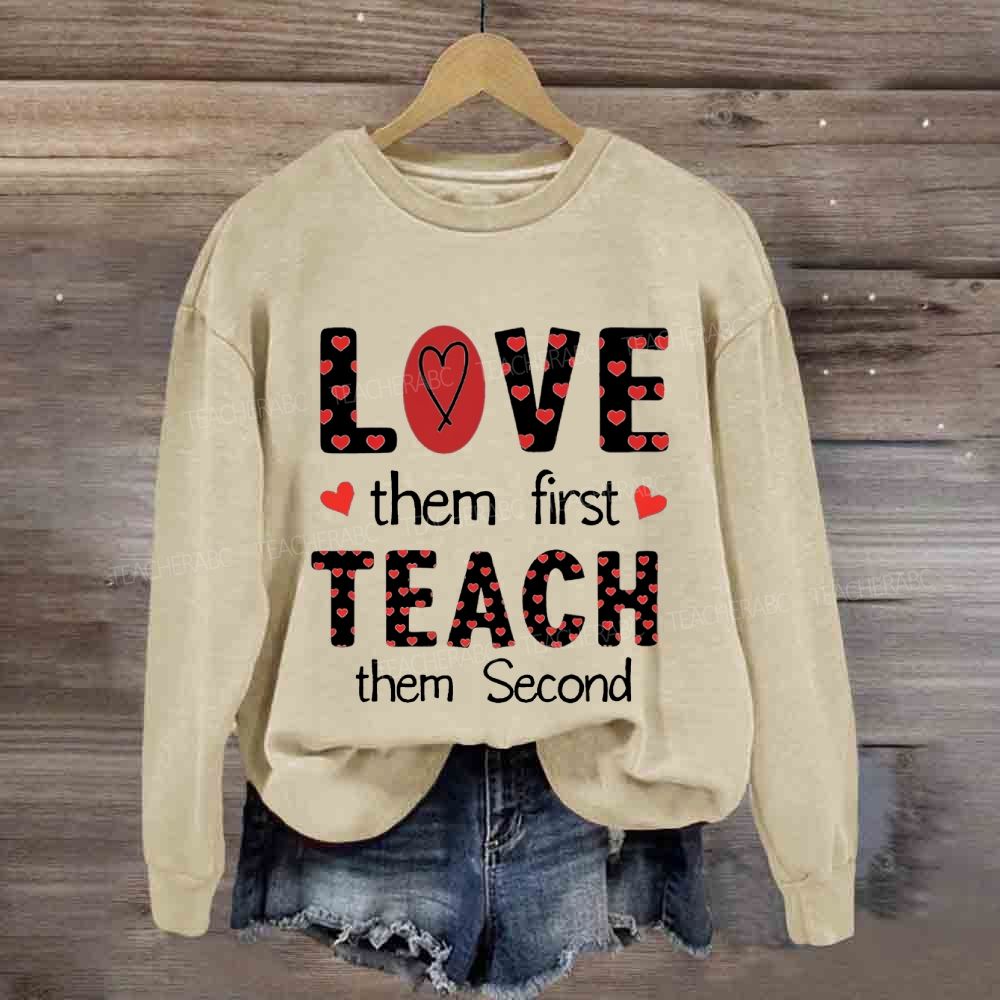 Red Heart Love Them First Teach Them Second Sweatshirt