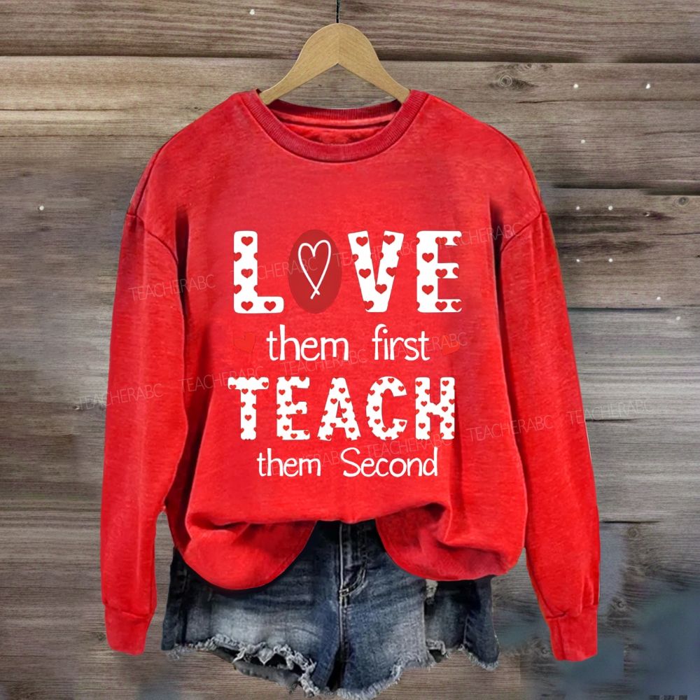 Red Heart Love Them First Teach Them Second Sweatshirt