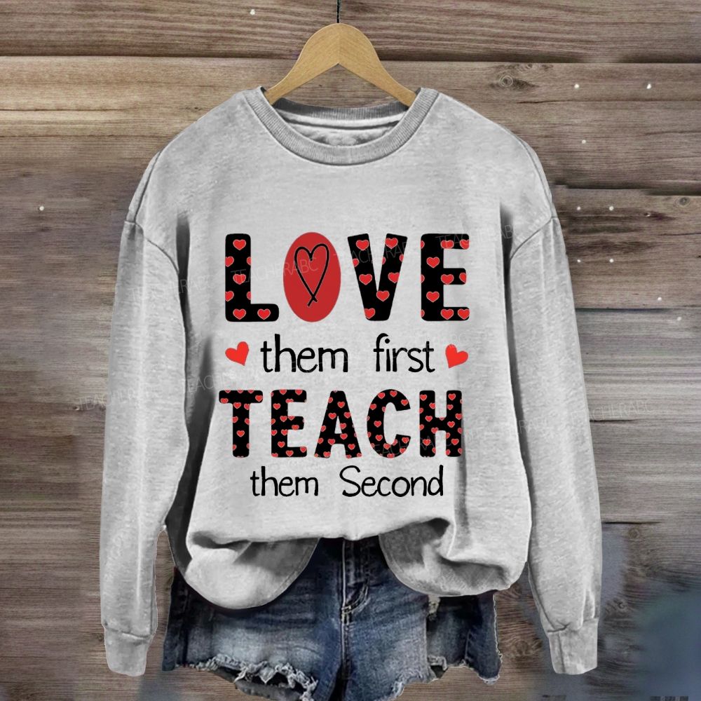 Red Heart Love Them First Teach Them Second Sweatshirt