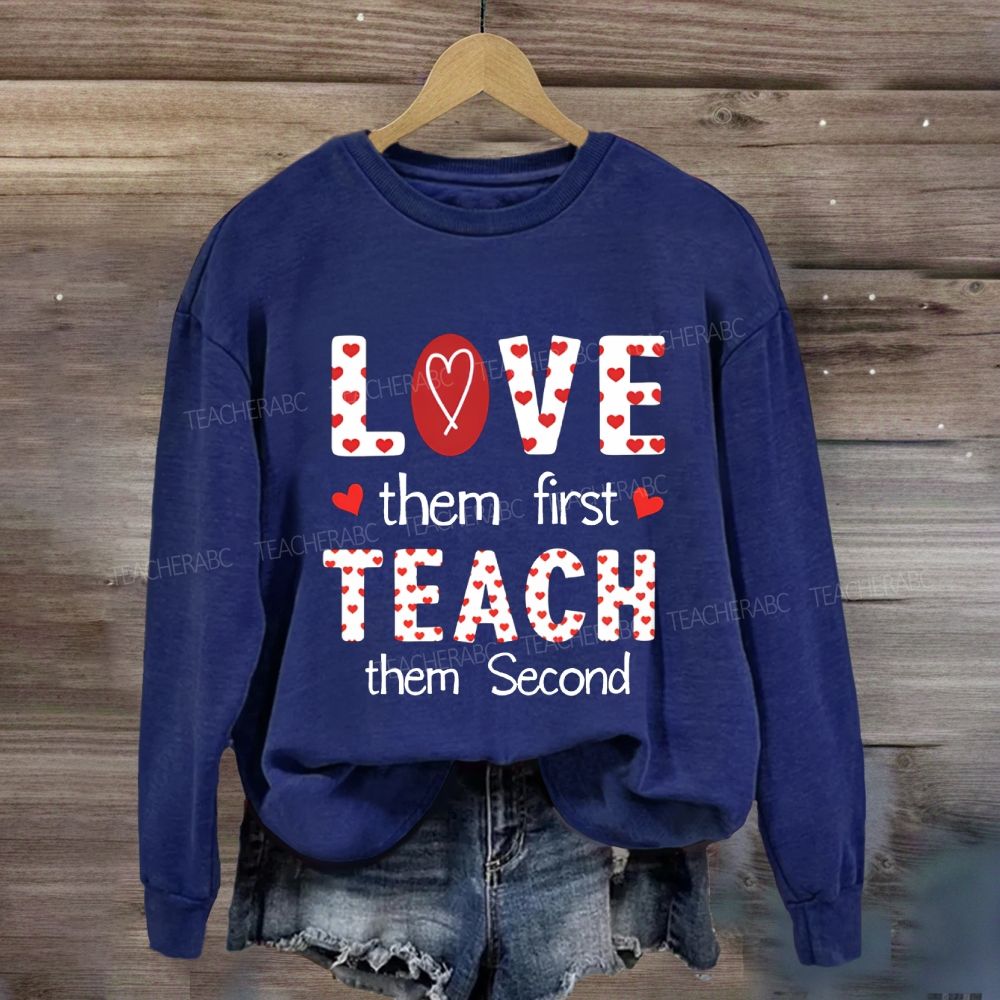 Red Heart Love Them First Teach Them Second Sweatshirt