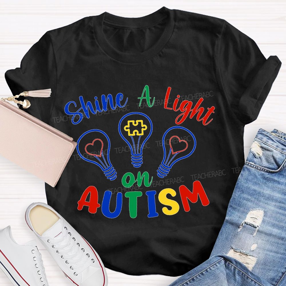 Shine A Light Autism Colored Lettering And Light Bulbs T-shirt