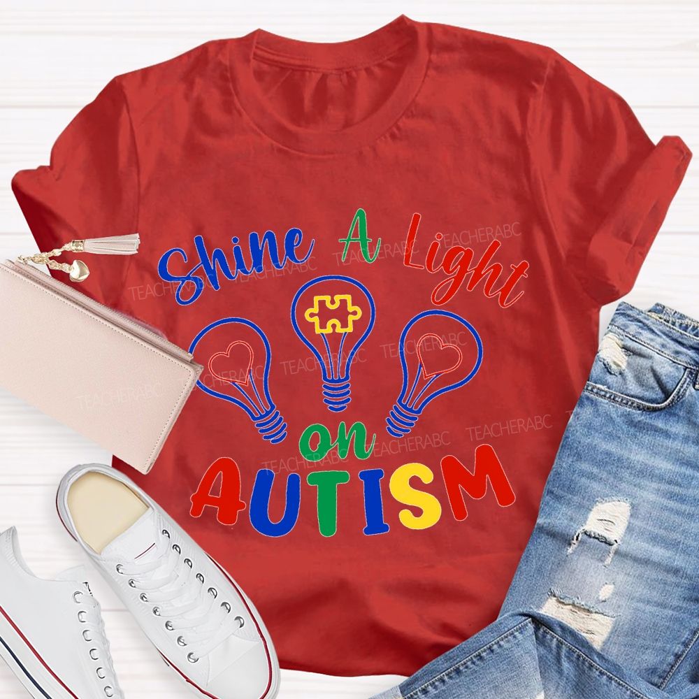Shine A Light Autism Colored Lettering And Light Bulbs T-shirt