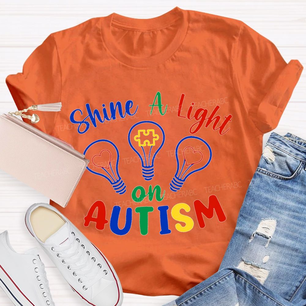 Shine A Light Autism Colored Lettering And Light Bulbs T-shirt