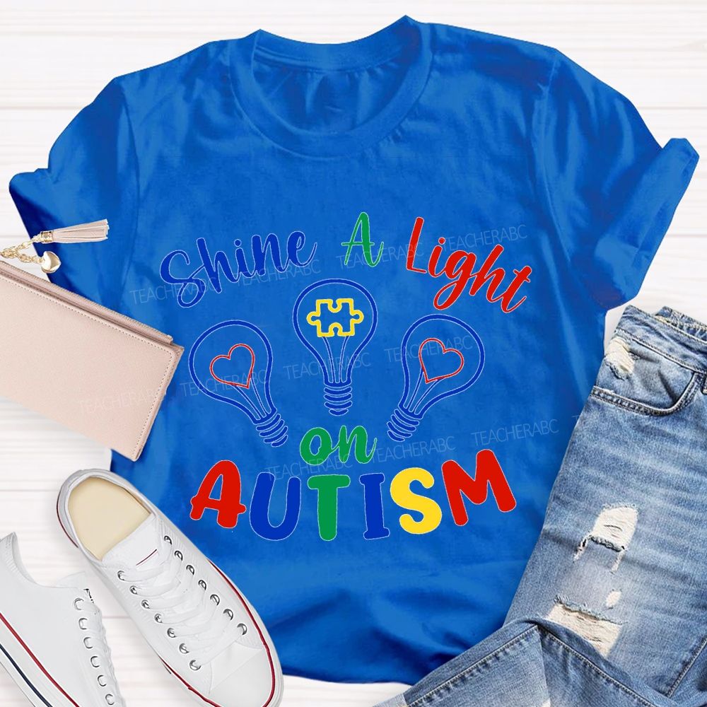 Shine A Light Autism Colored Lettering And Light Bulbs T-shirt