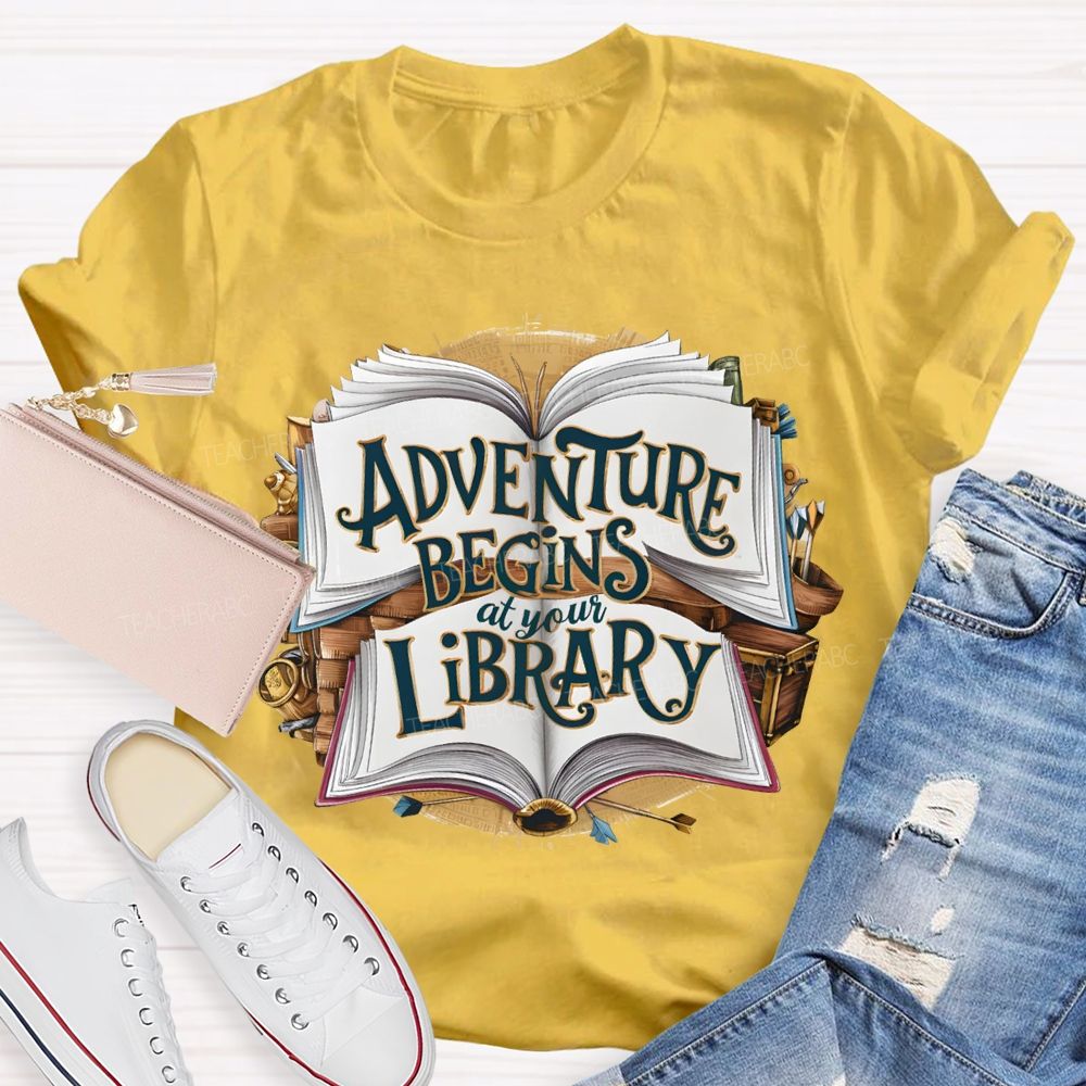 Adventure Begins At Your Library Teacher T-shirt