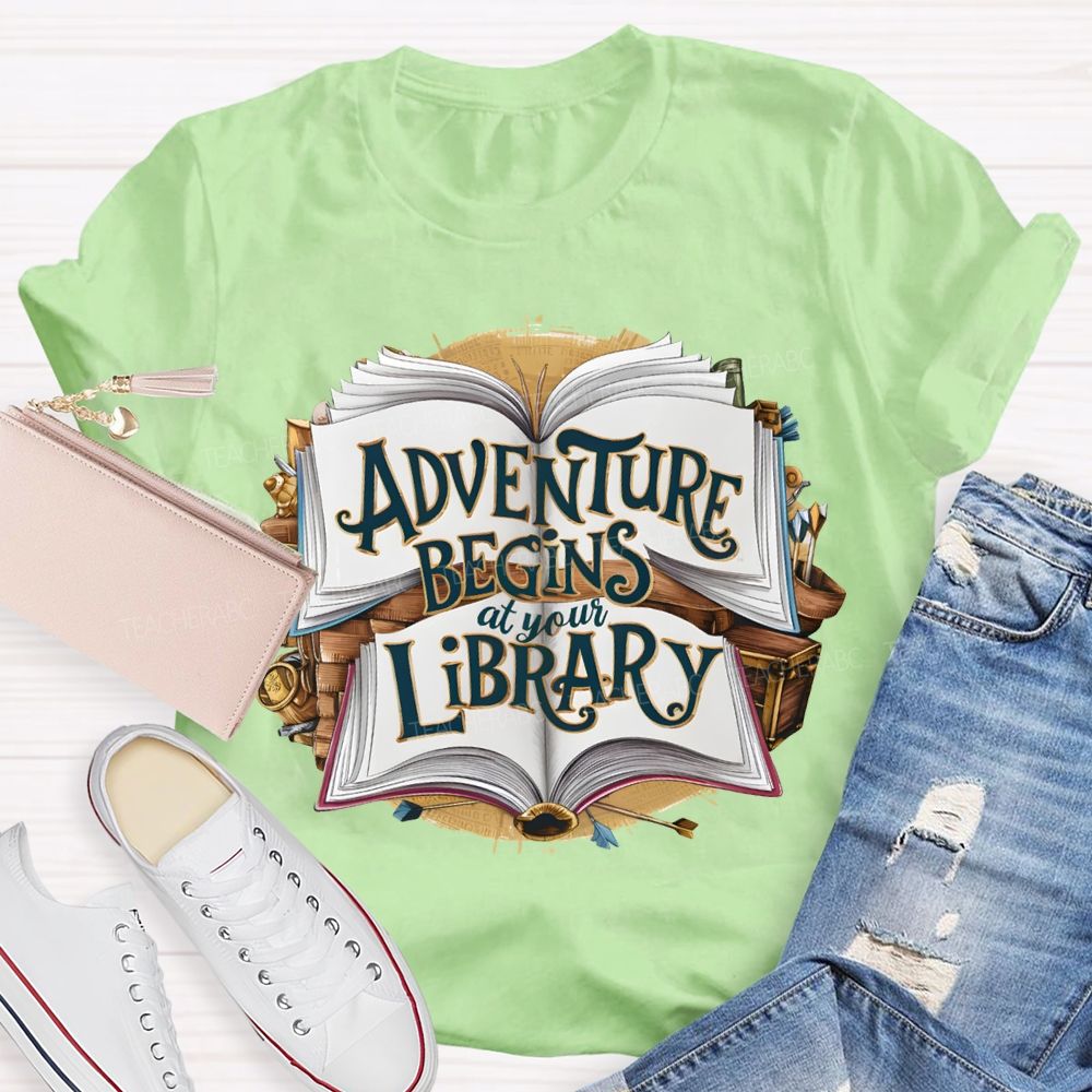 Adventure Begins At Your Library Teacher T-shirt