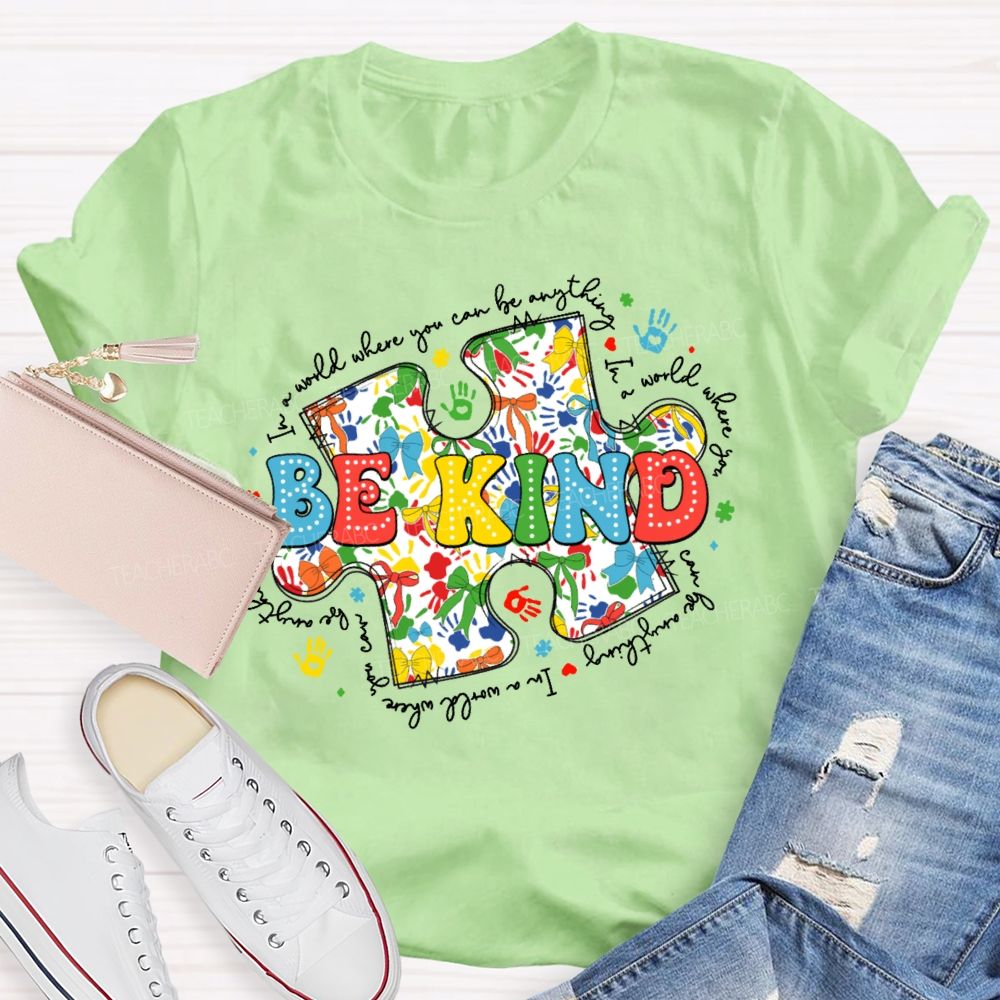 In A World Where You Can Be Anything Be Kind Colorful Letters Puzzle  Teacher T-shirt