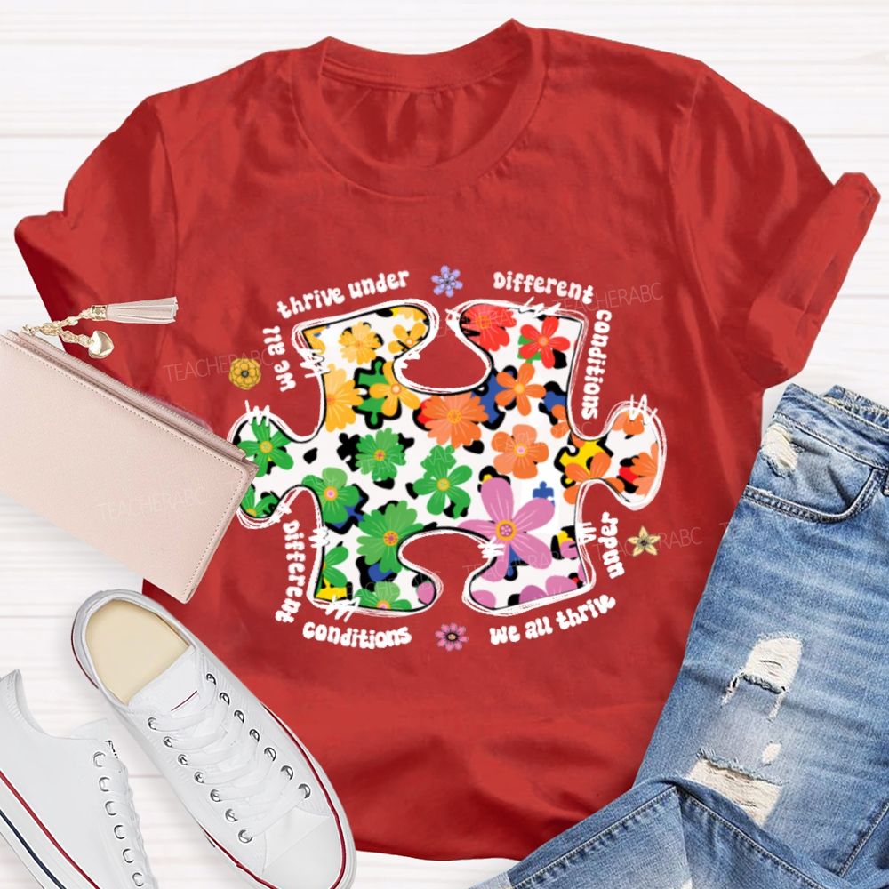 We Are Thrive Under Different Conditions Flowers Puzzle Teacher T-shirt
