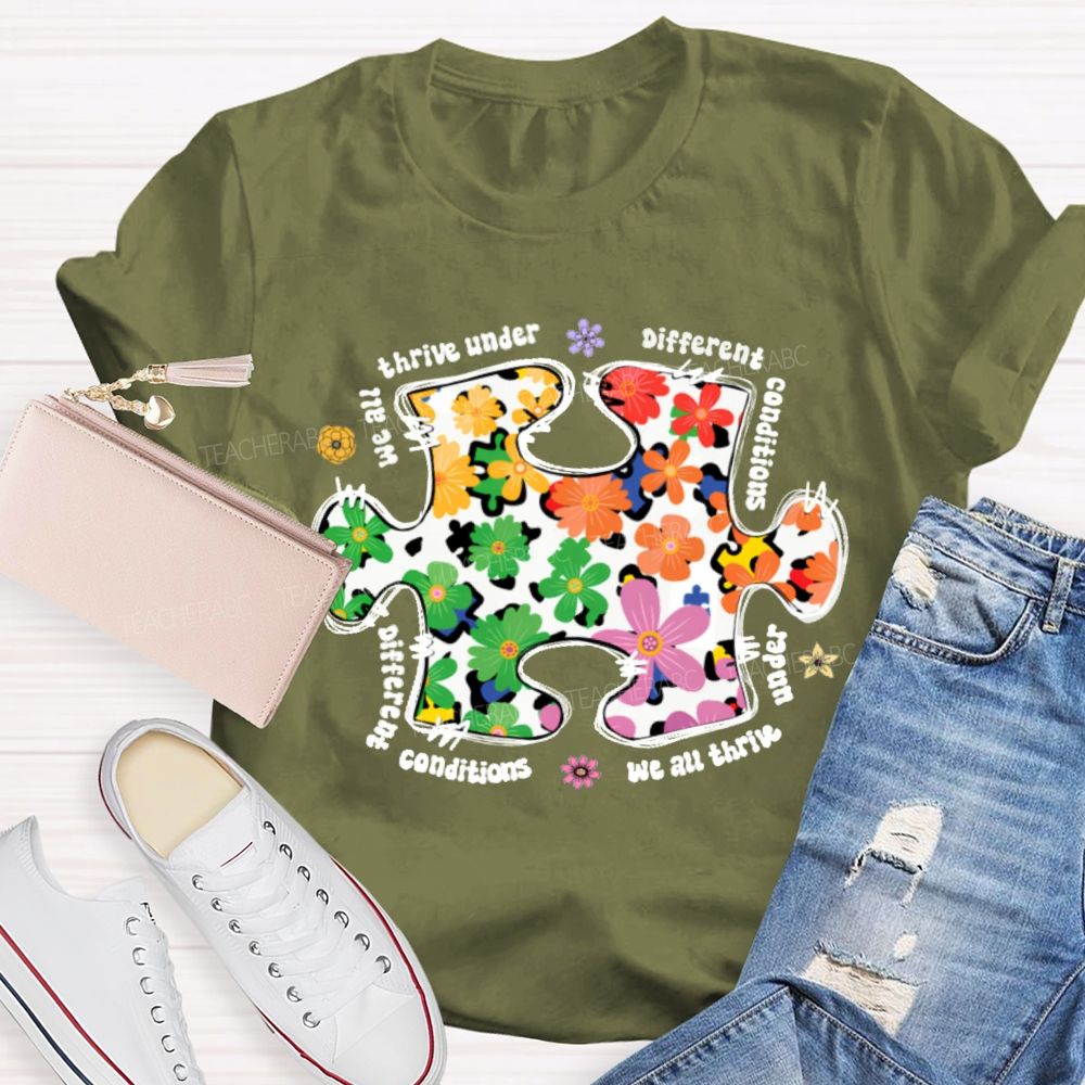 We Are Thrive Under Different Conditions Flowers Puzzle Teacher T-shirt