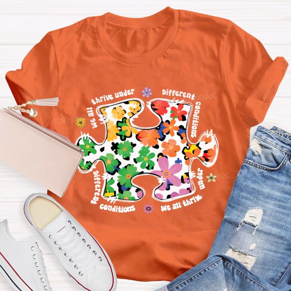 We Are Thrive Under Different Conditions Flowers Puzzle Teacher T-shirt
