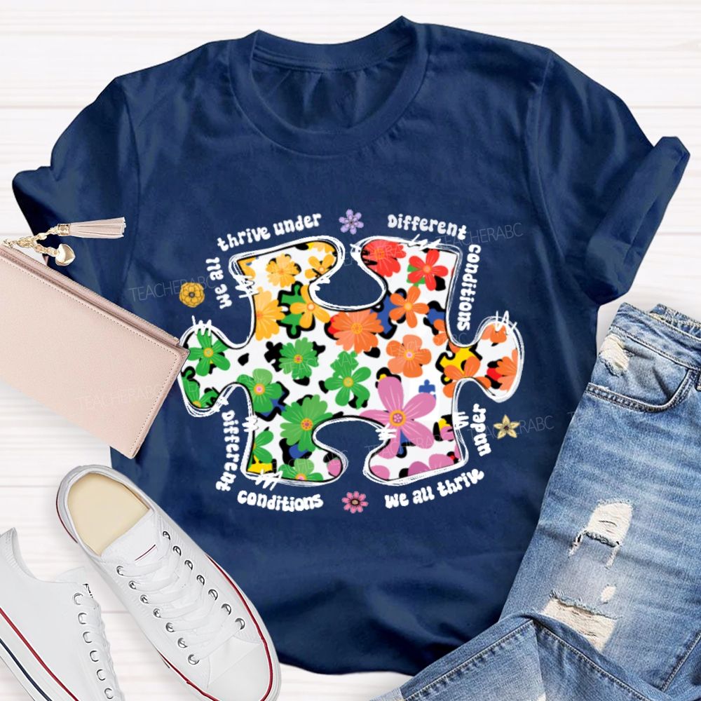 We Are Thrive Under Different Conditions Flowers Puzzle Teacher T-shirt