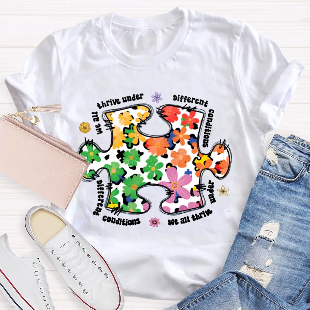 We Are Thrive Under Different Conditions Flowers Puzzle Teacher T-shirt