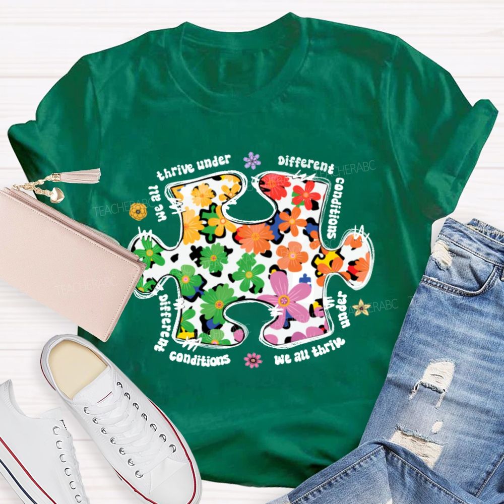 We Are Thrive Under Different Conditions Flowers Puzzle Teacher T-shirt