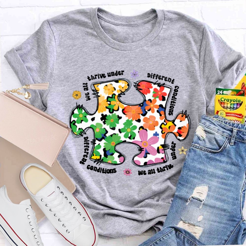 We Are Thrive Under Different Conditions Flowers Puzzle Teacher T-shirt