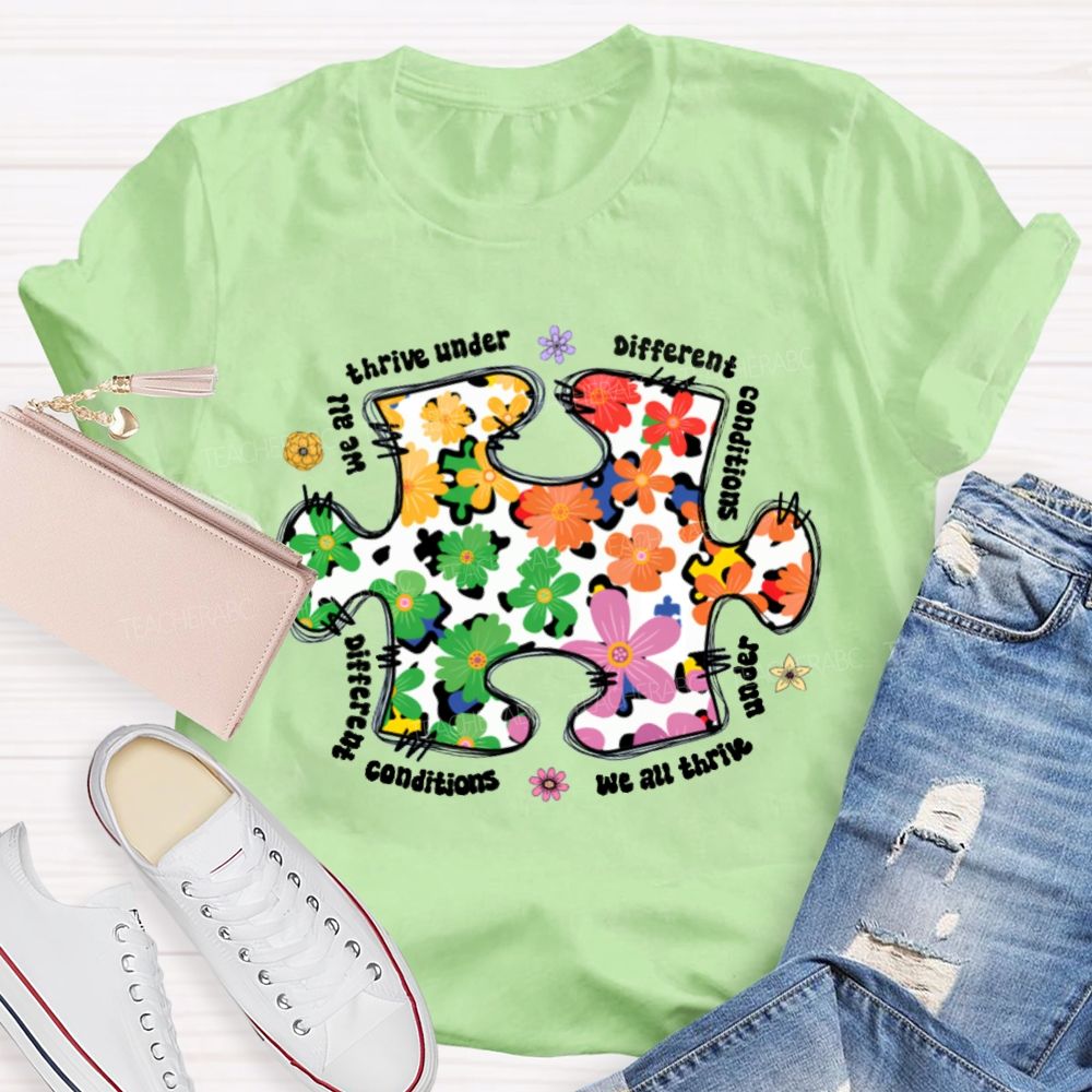 We Are Thrive Under Different Conditions Flowers Puzzle Teacher T-shirt