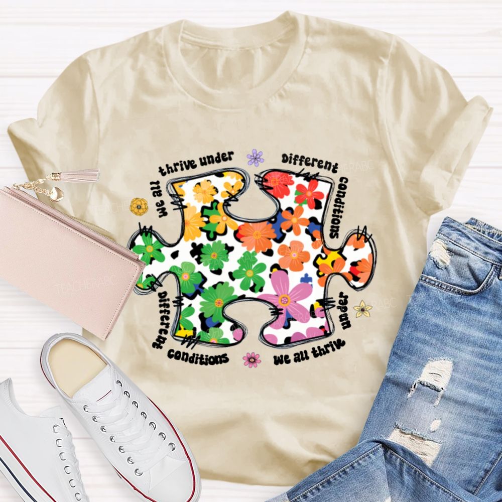 We Are Thrive Under Different Conditions Flowers Puzzle Teacher T-shirt