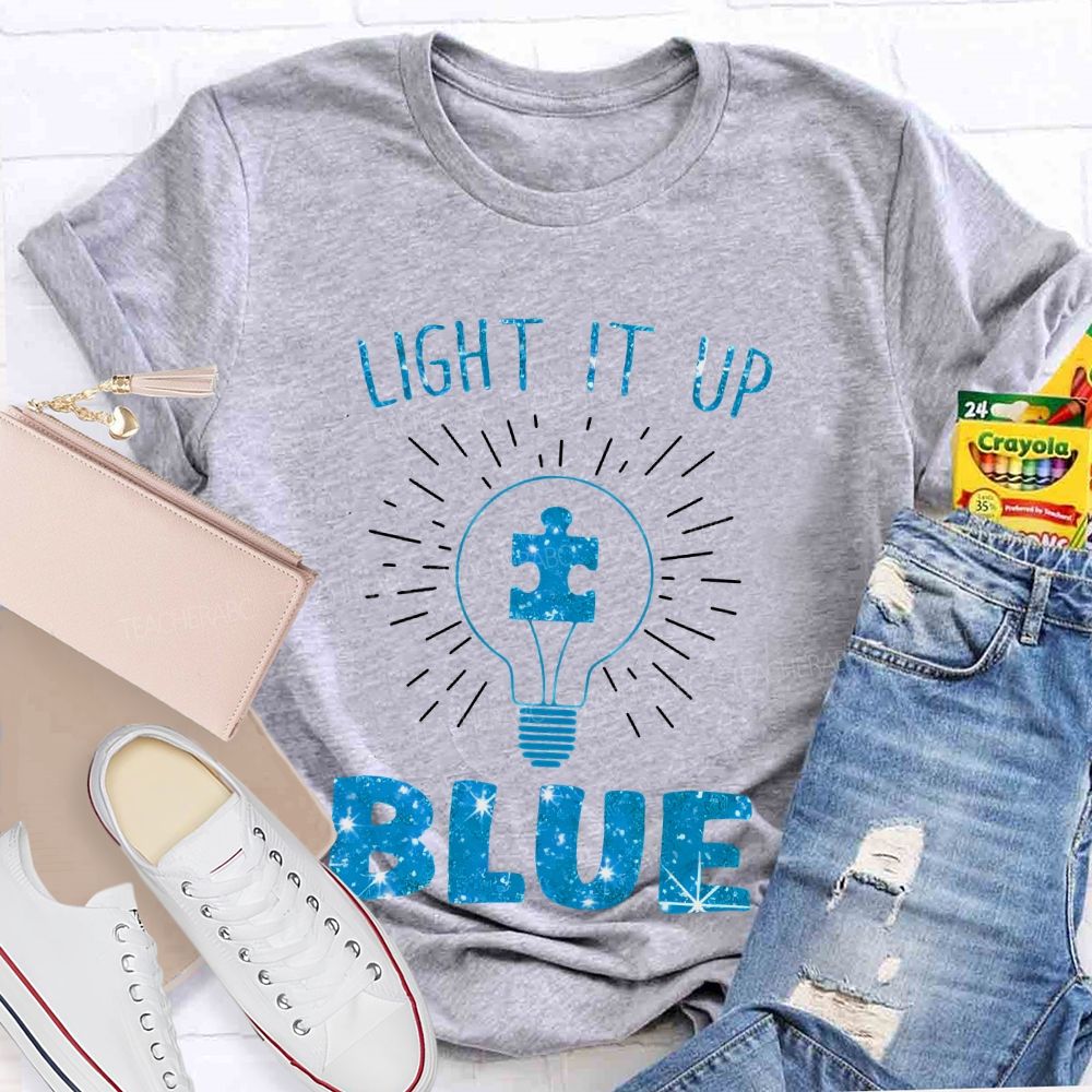 Light It Up Blue Light Bulb Graphic  Teacher T-shirt
