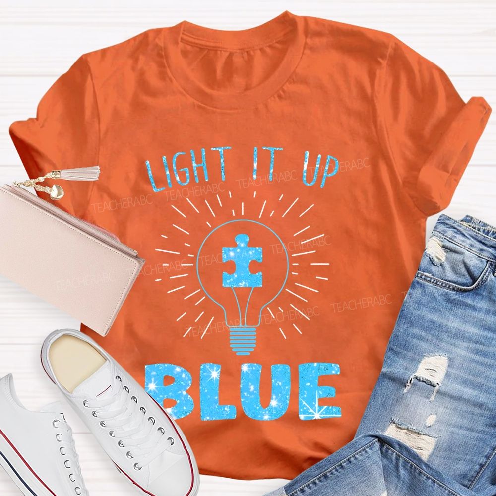 Light It Up Blue Light Bulb Graphic  Teacher T-shirt
