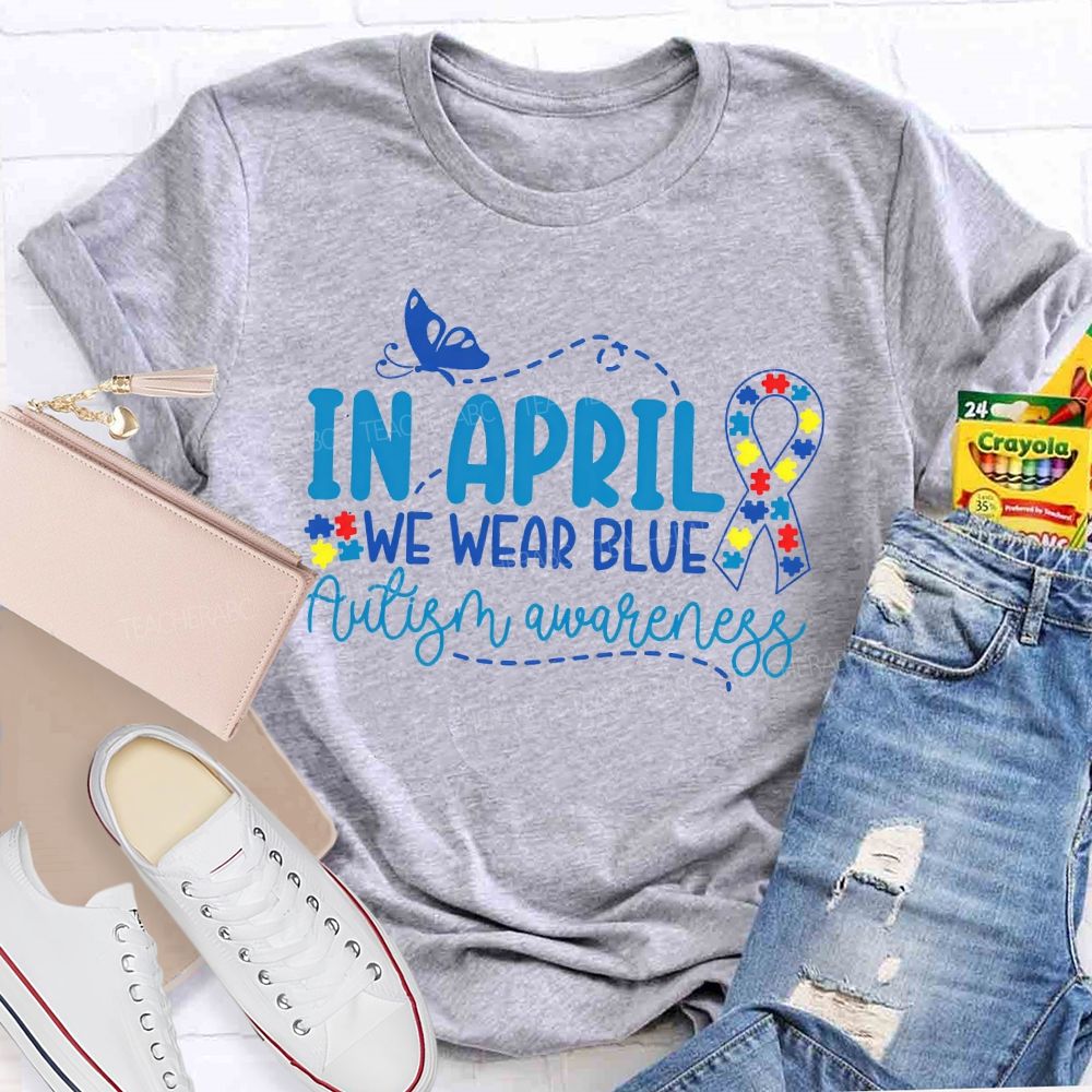 In April We Wear Blue  Autism Awareness Puzzle Ribbon  Teacher T-shirt