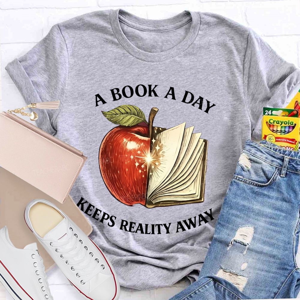 A Book A Day Keeps Reality Away Graphic  Teacher T-shirt