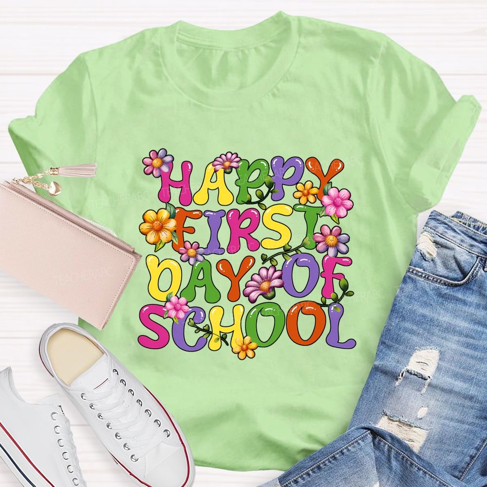 Happy First Day Of School Colorful Fonts And Flowers Teacher T-shirt