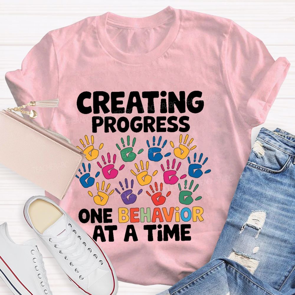 Creating Progress One Behavior At A Time  Teacher T-shirt