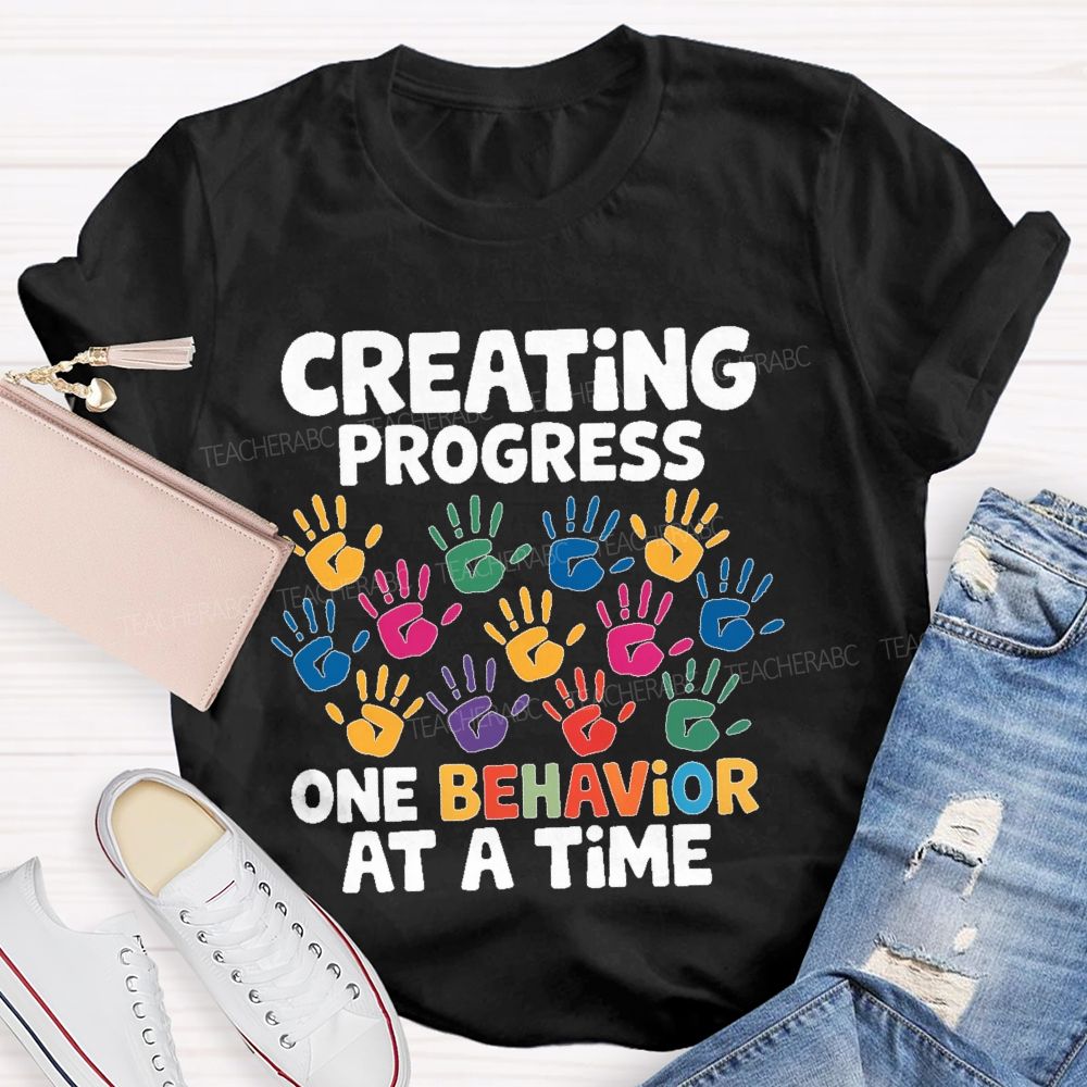 Creating Progress One Behavior At A Time  Teacher T-shirt