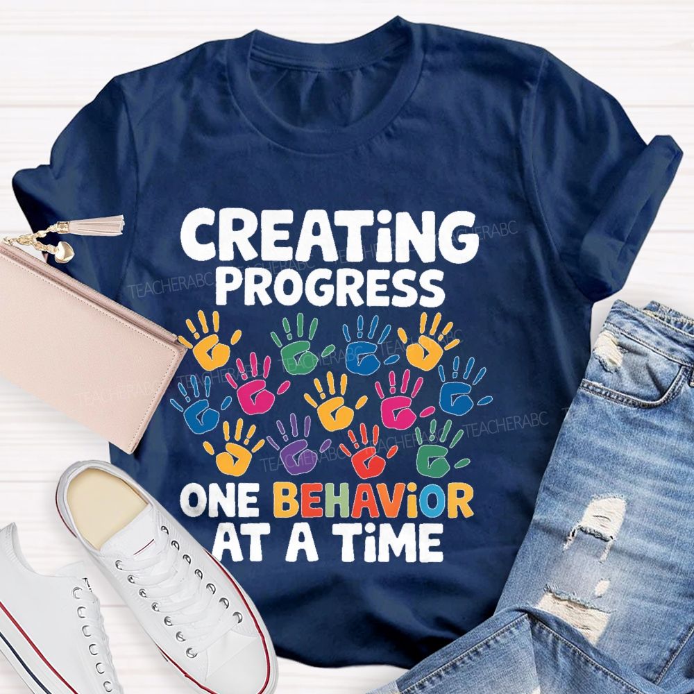 Creating Progress One Behavior At A Time  Teacher T-shirt