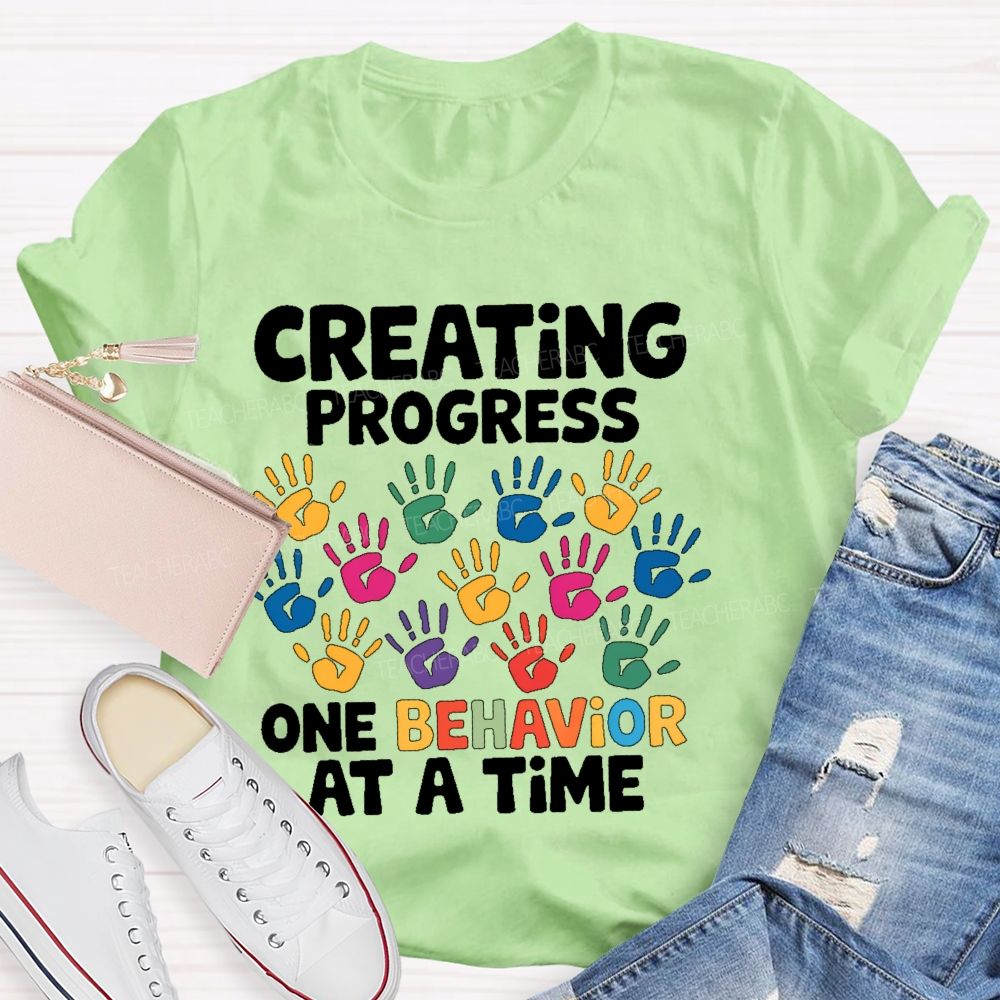 Creating Progress One Behavior At A Time  Teacher T-shirt
