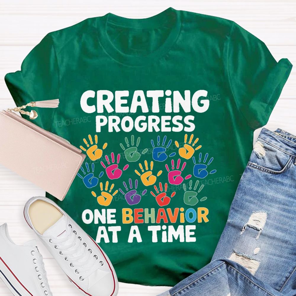 Creating Progress One Behavior At A Time  Teacher T-shirt