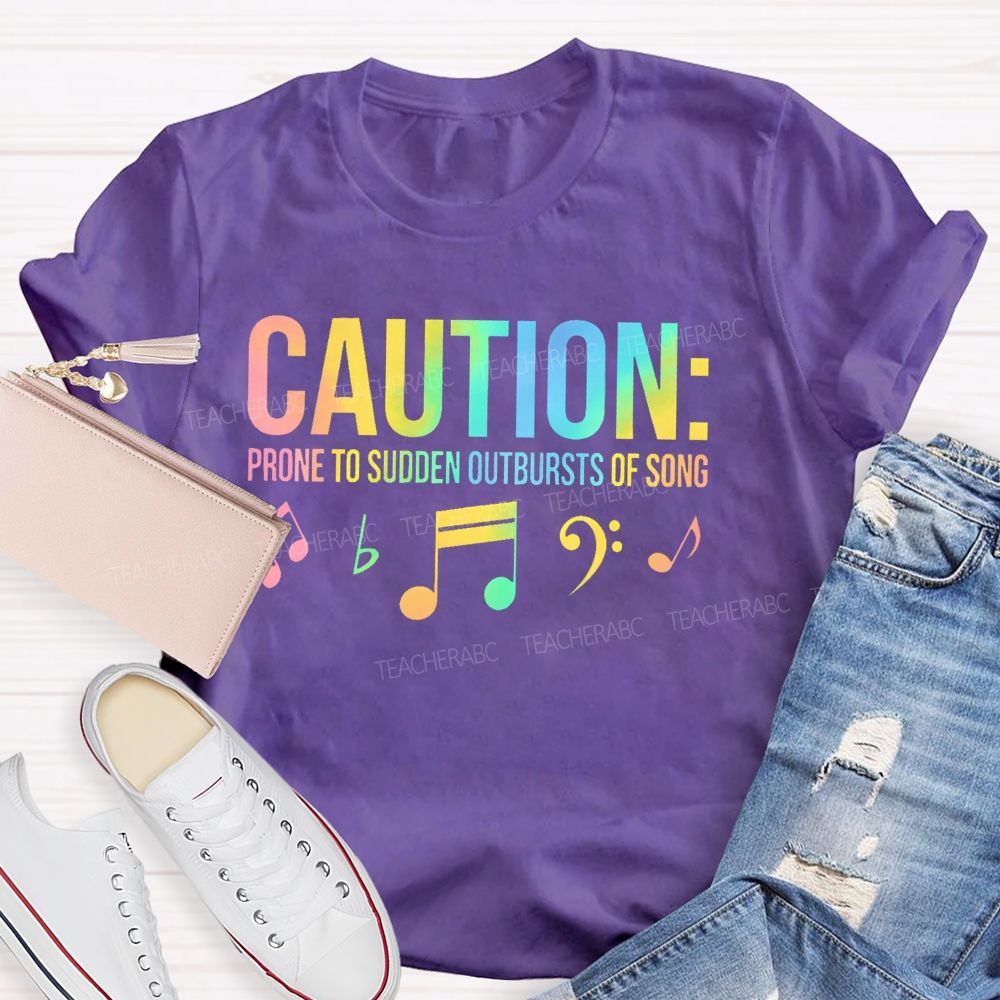 Caution Prone To Sudden Outbursts Of Song Colorful Letters  Teacher T-shirt