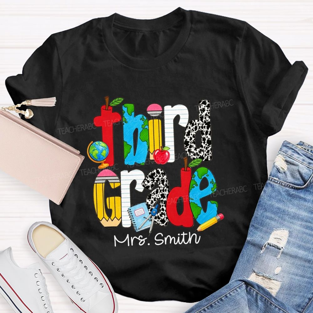Personalized Name And Grade Cow Print And School‑Supply Doodle Teacher T-shirt