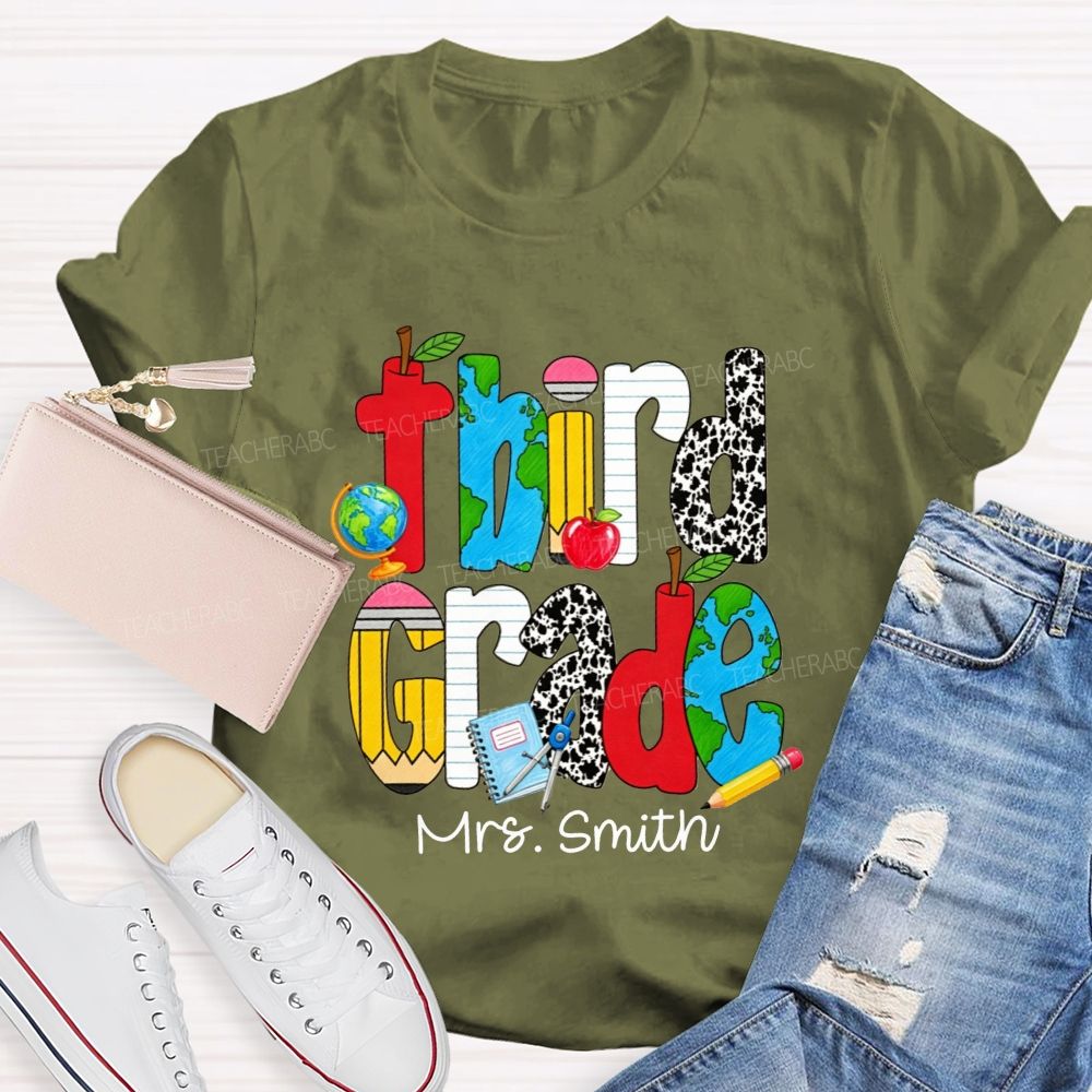 Personalized Name And Grade Cow Print And School‑Supply Doodle Teacher T-shirt