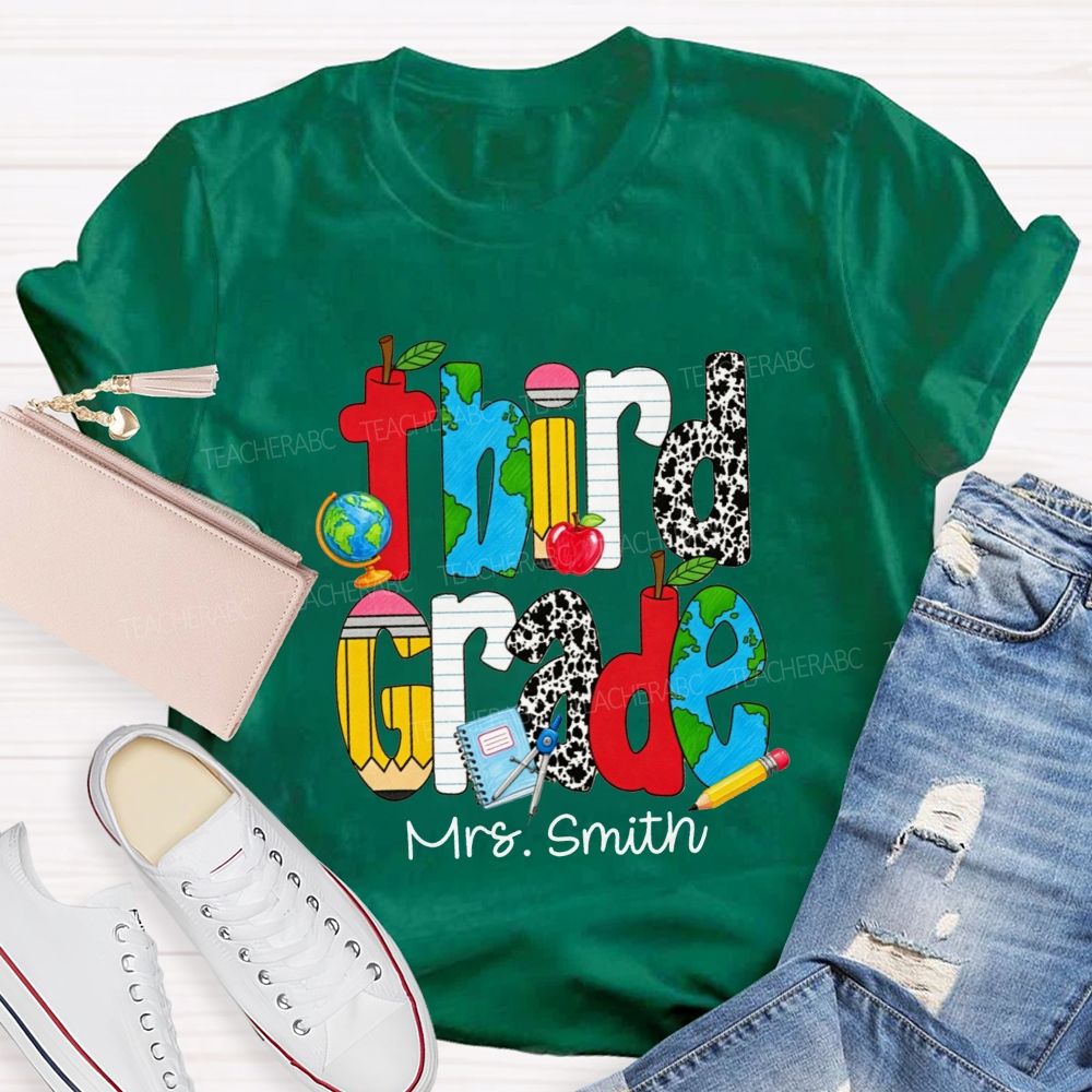 Personalized Name And Grade Cow Print And School‑Supply Doodle Teacher T-shirt