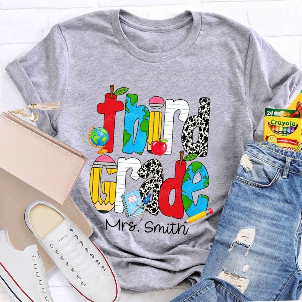 Personalized Name And Grade Cow Print And School‑Supply Doodle Teacher T-shirt