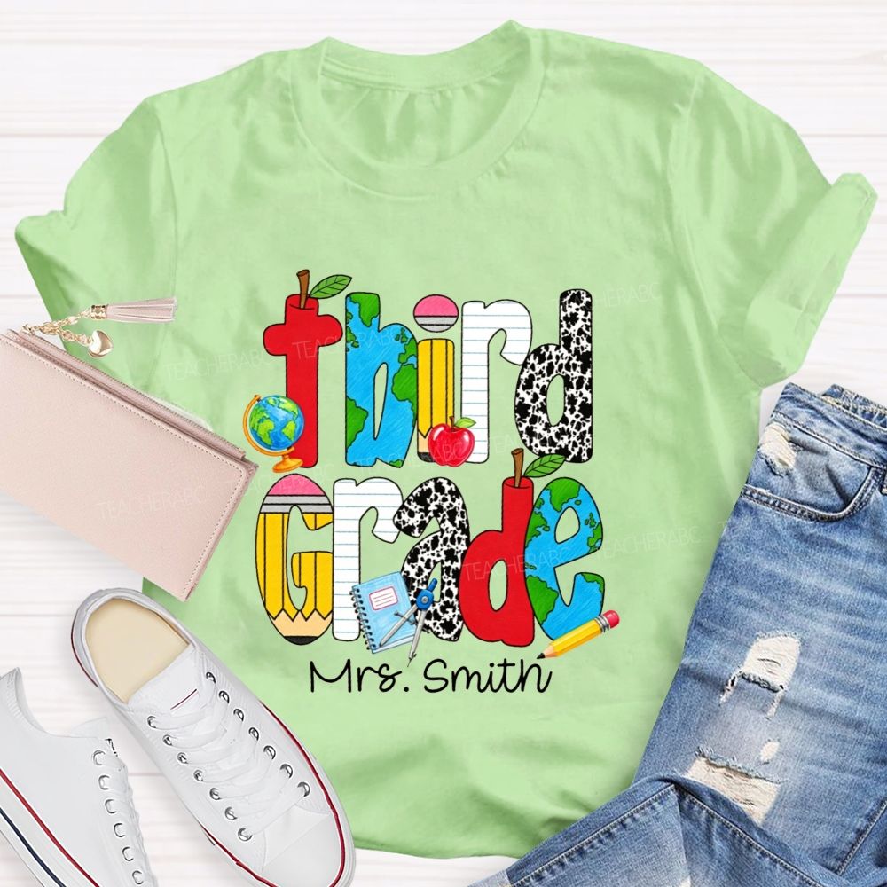 Personalized Name And Grade Cow Print And School‑Supply Doodle Teacher T-shirt
