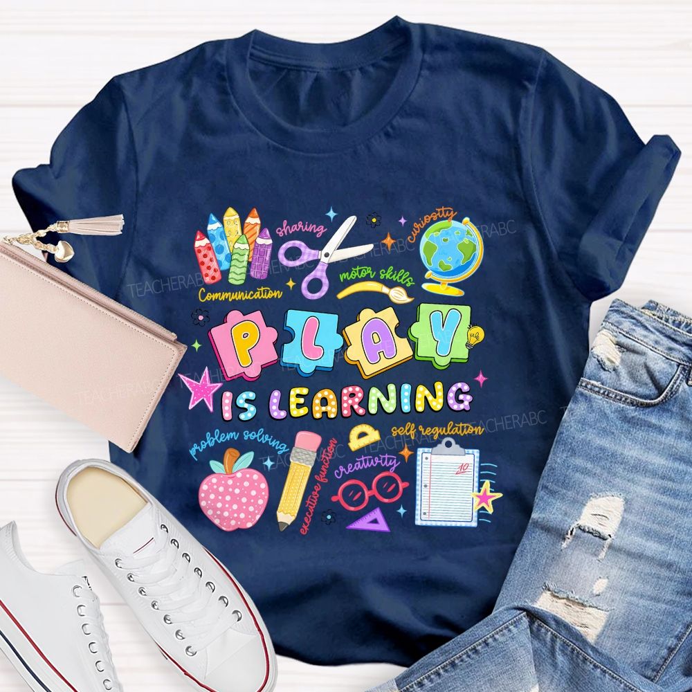 Play Is Learning Sharing Curiosity Motor Skills Communication Problem Solving Teacher T-shirt