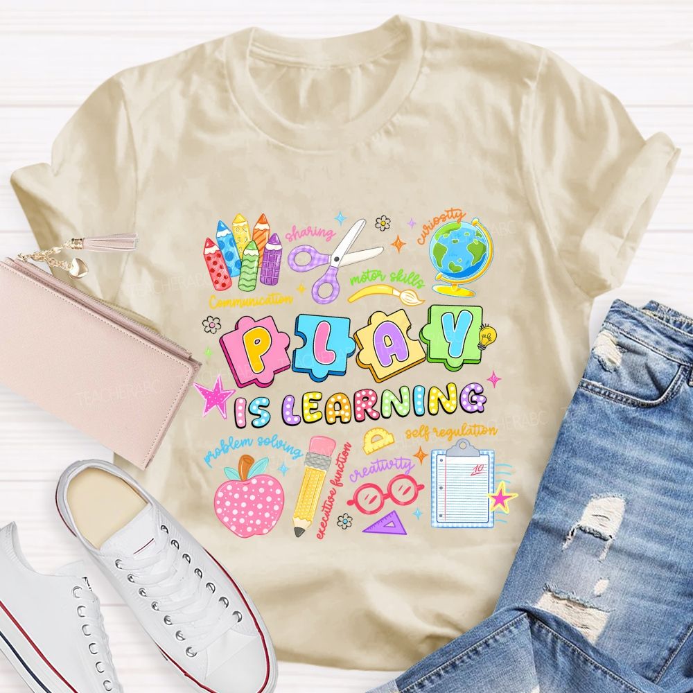 Play Is Learning Sharing Curiosity Motor Skills Communication Problem Solving Teacher T-shirt