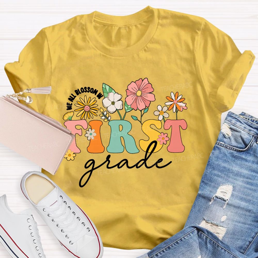 Personalized Grade We All Blossom In First Grade Floral Teacher T-Shirt