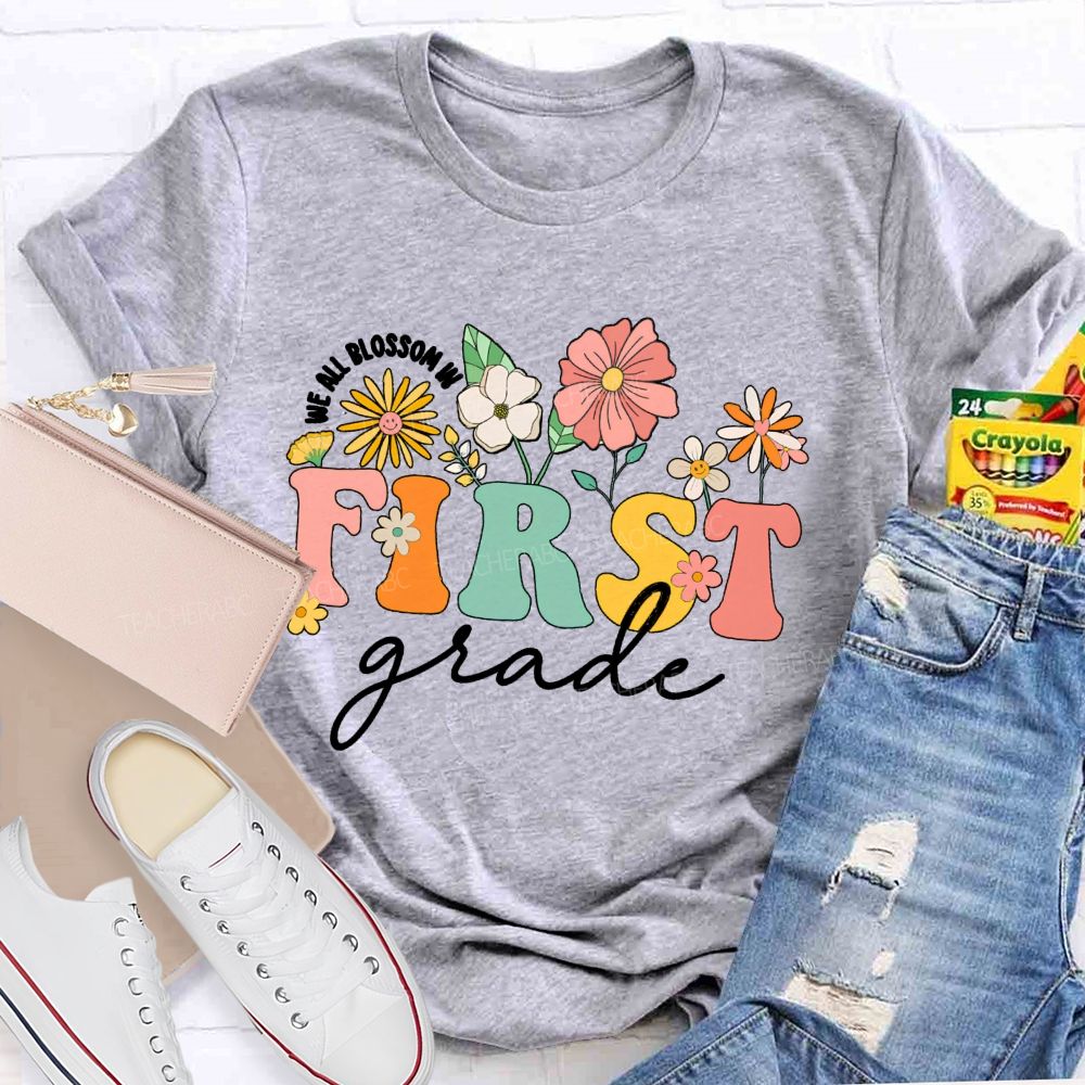 Personalized Grade We All Blossom In First Grade Floral Teacher T-Shirt