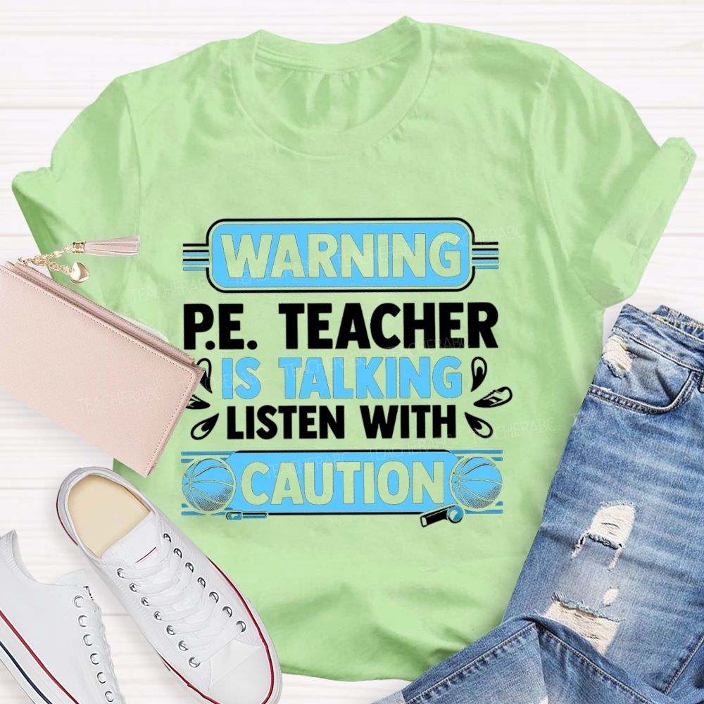 Warning P.E. Teacher Is Talking Listen With Caution Teacher T-shirt