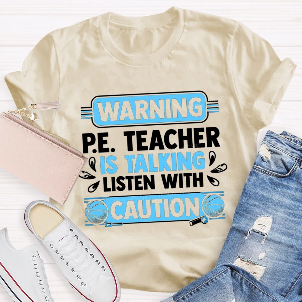 Warning P.E. Teacher Is Talking Listen With Caution Teacher T-shirt
