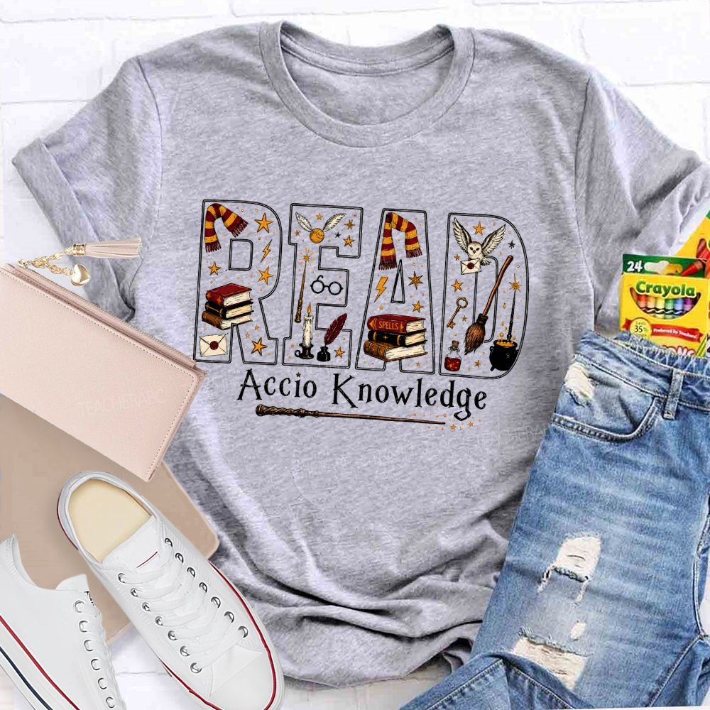Read Accio Knowledge Halloween Teacher T-shirt
