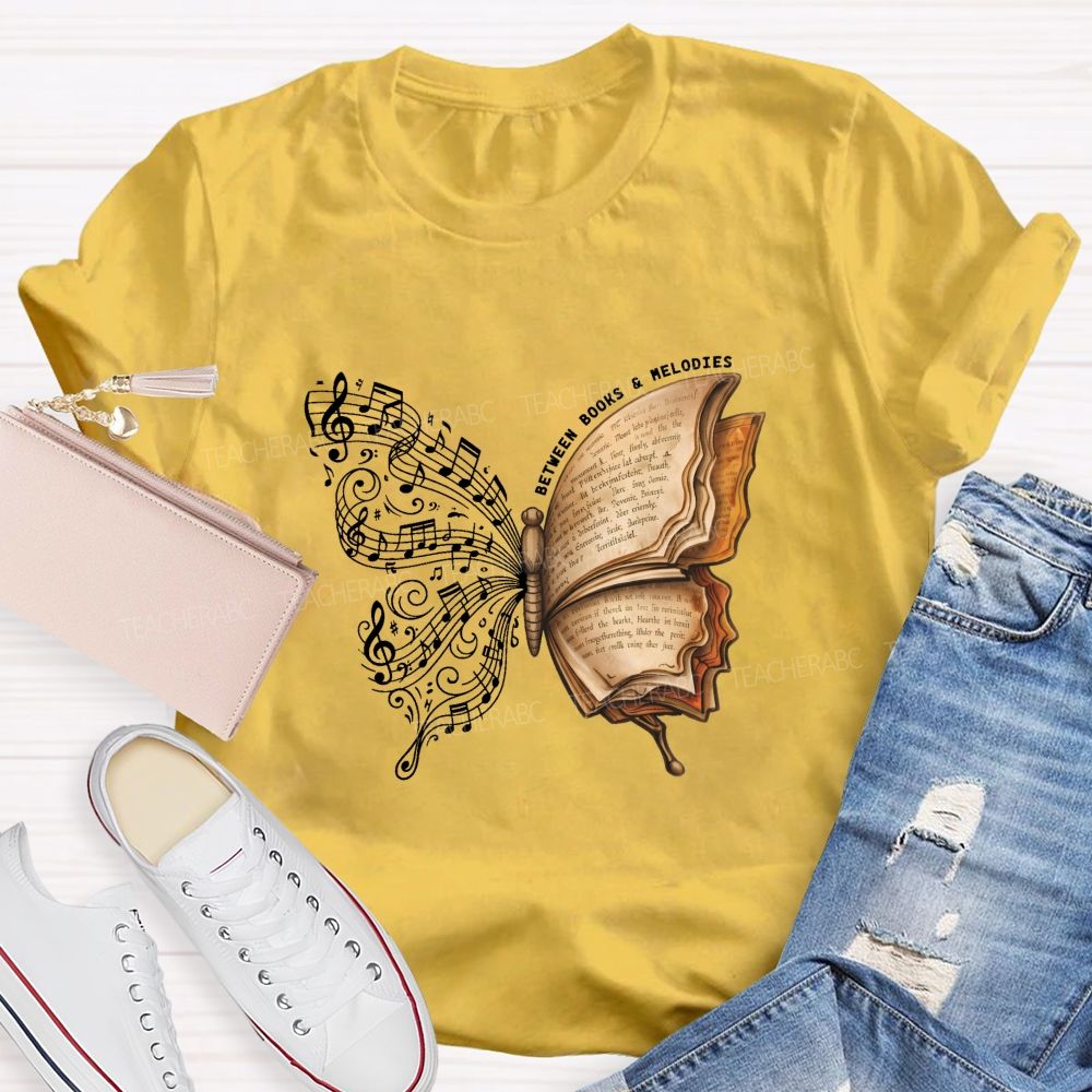 Between Books And Melodies Book Music Butterfly Teacher T-shirt