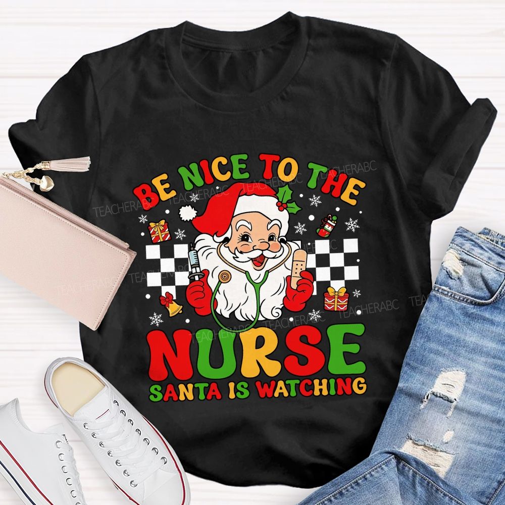 Be Nice To The Nurse Santa Is Watching Santa Claus With A Stethoscope Teacher T-shirt