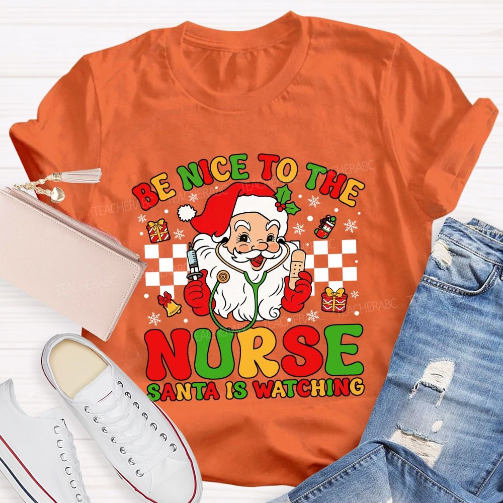 Be Nice To The Nurse Santa Is Watching Santa Claus With A Stethoscope Teacher T-shirt