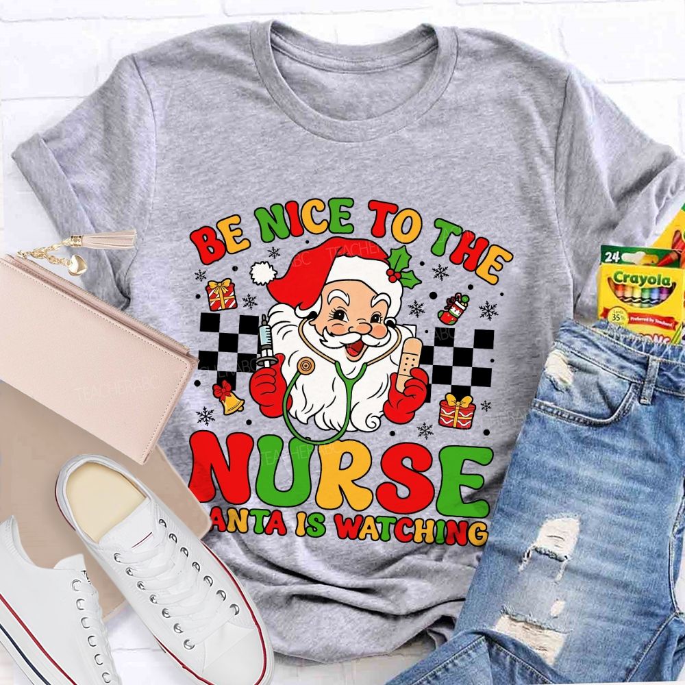 Be Nice To The Nurse Santa Is Watching Santa Claus With A Stethoscope Teacher T-shirt